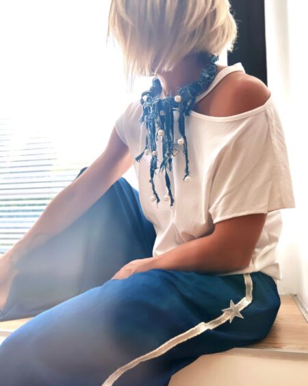 Maglia bianca asimmetrica